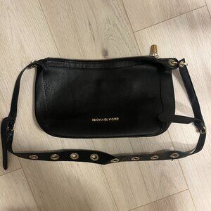 Shoulder bag with grommet details